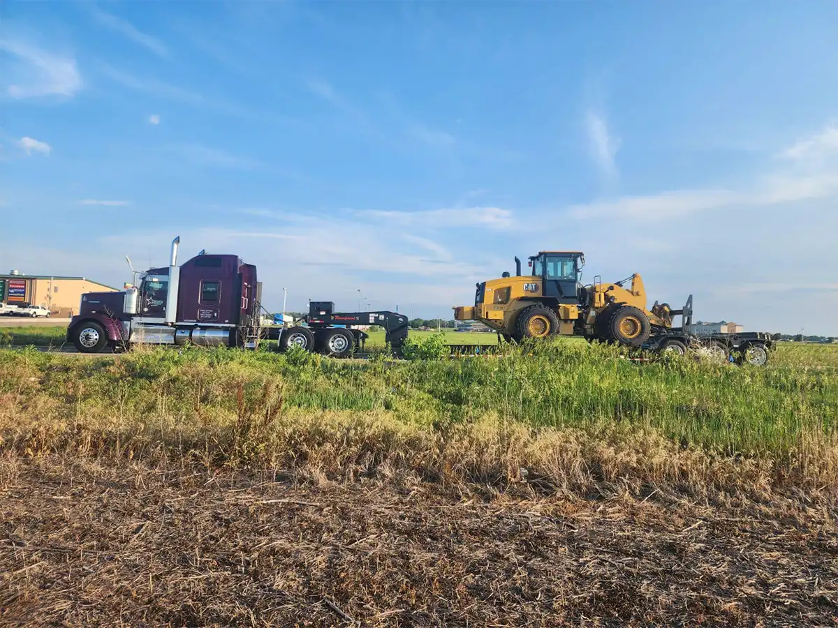 truck towing heavy equipment