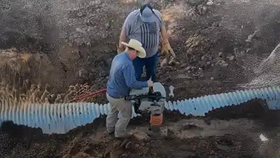 construction crews installing an underground pipe